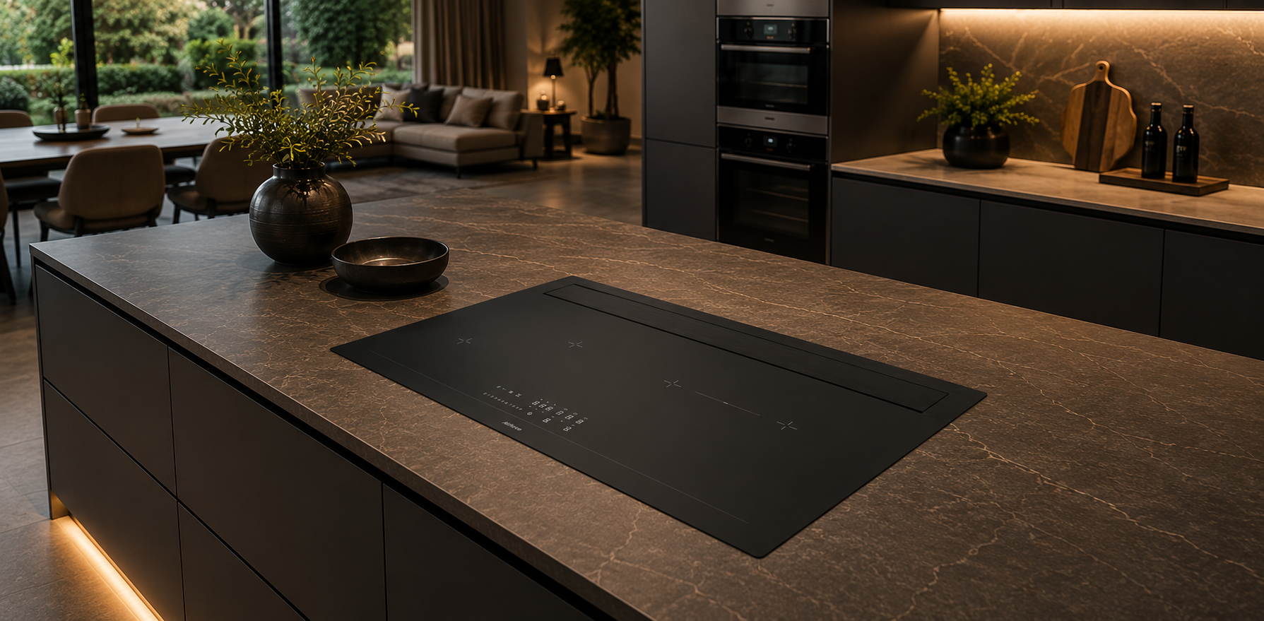 Modern kitchen island with induction cooktop in a dimly lit room